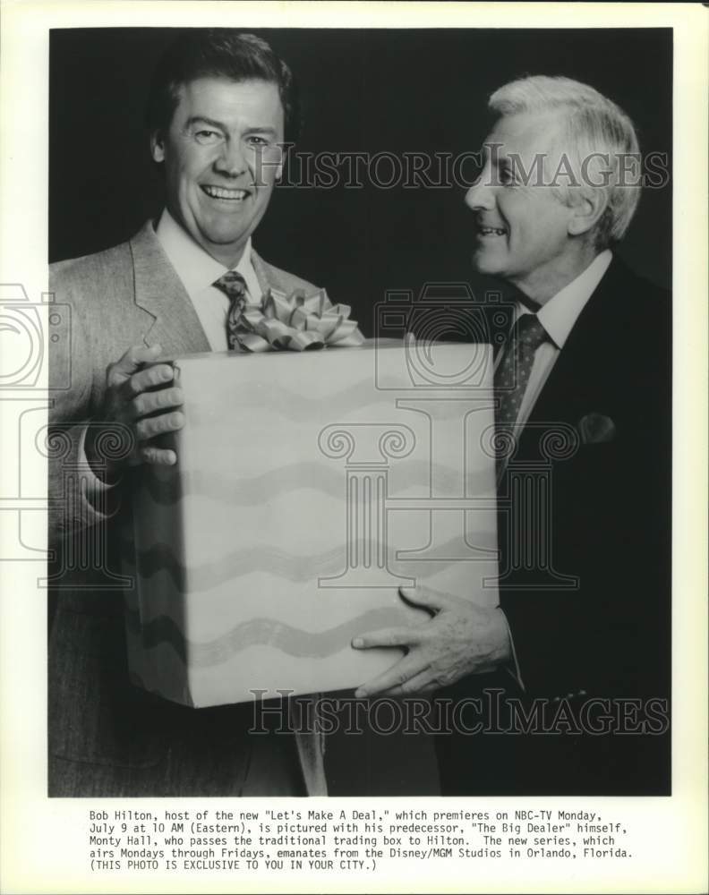 Load image into Gallery viewer, 1990 Press Photo Bob Hilton, new host of "Let's Make A Deal," with Monty Hall.

