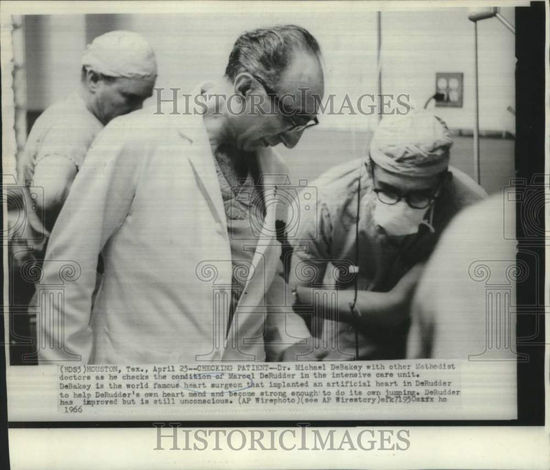 Load image into Gallery viewer, 1966 Press Photo Dr. Michael DeRudder &amp; others check paitient Marcel DeRudder
