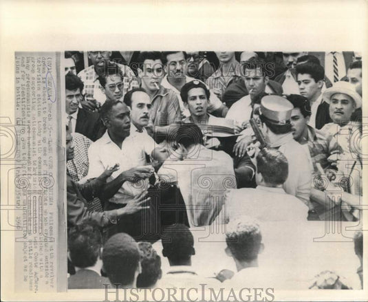 1960 Press Photo Policeman breaks up fight at Cuban television station in Havana