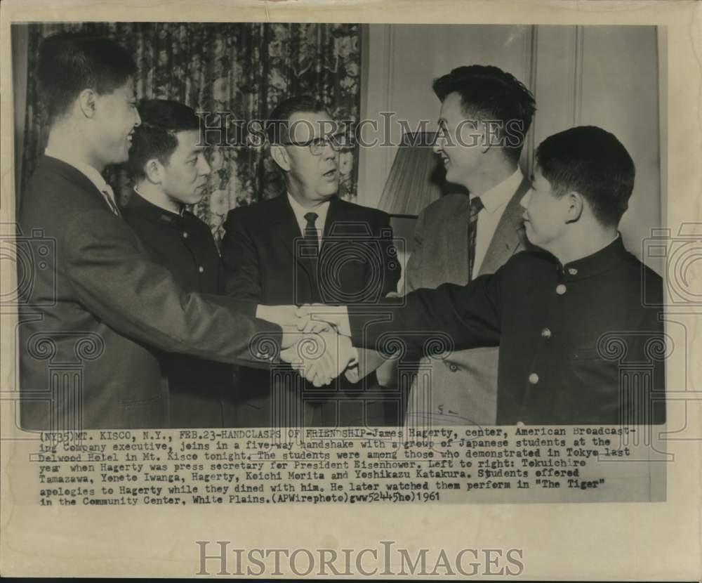 1961 Press Photo James Hagerty in five-way handshake at Delwood Petel