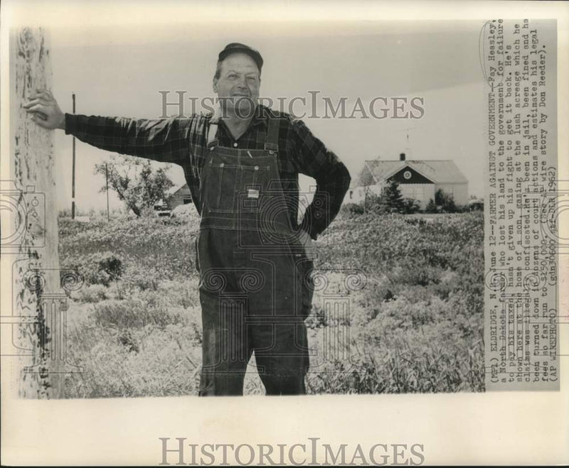 Load image into Gallery viewer, 1962 Press Photo Fay Heasley, North Dakota farmer, looks at lush acreage.
