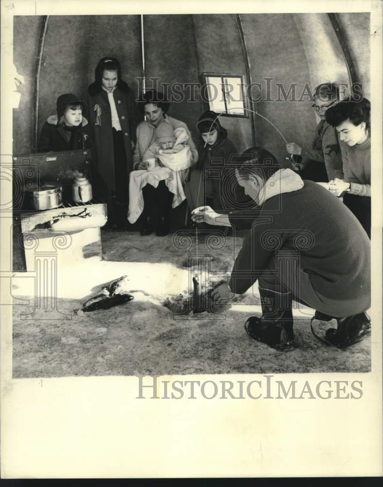Load image into Gallery viewer, 1967 Press Photo Ice fishing from inside igloo. - now10547
