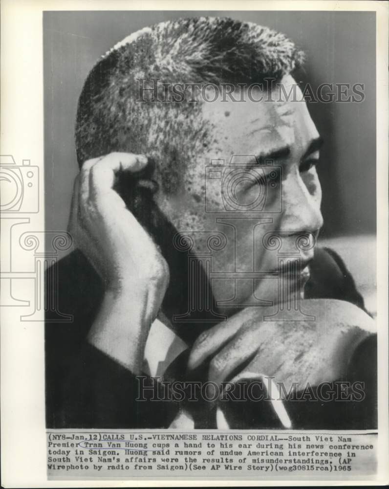 Load image into Gallery viewer, 1965 Press Photo South Vietnam Premier Tran Van Huong listens at news conference
