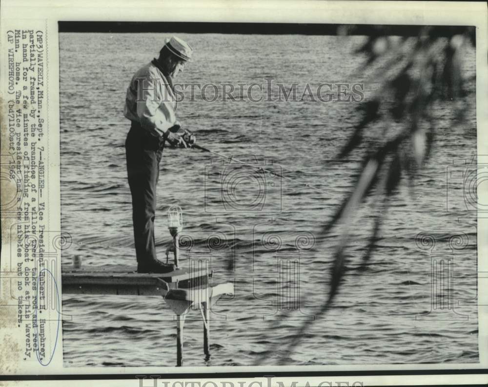 1968 Press Photo Vice President Humphrey fishes from dock of his Minnesota home