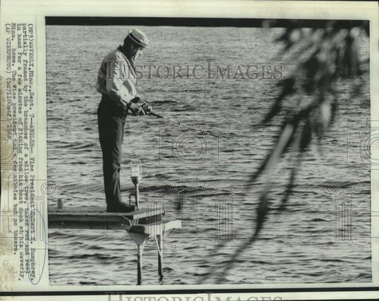 1968 Press Photo Vice President Humphrey fishes from dock of his Minnesota home