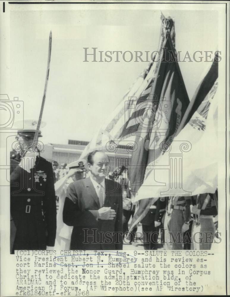 Load image into Gallery viewer, 1968 Press Photo Vice President Humphrey and Captain Shebel salute the Colors.
