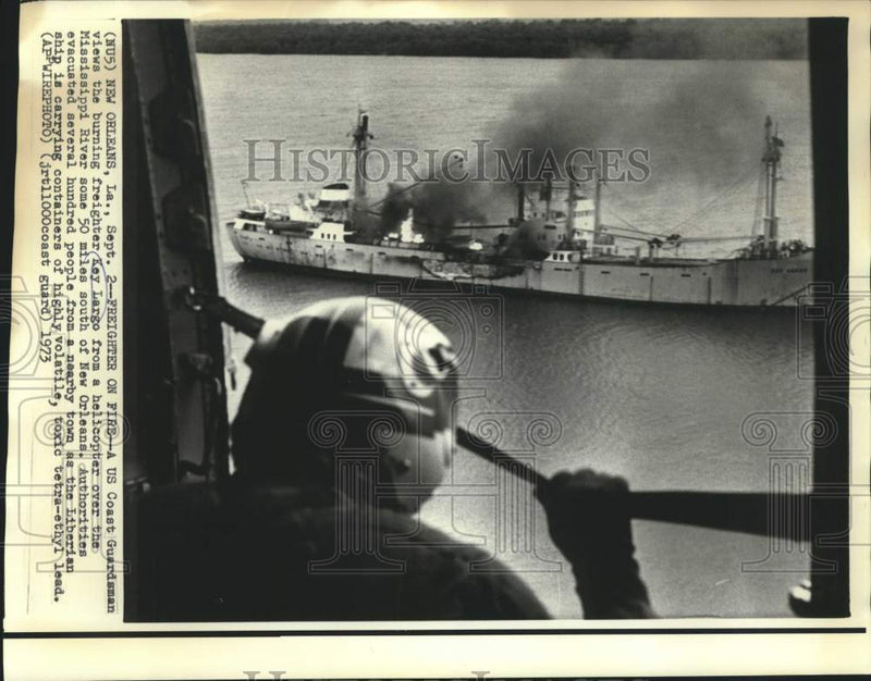 Load image into Gallery viewer, 1973 Press Photo US Coast Guardsman views burning freighter Key Largo
