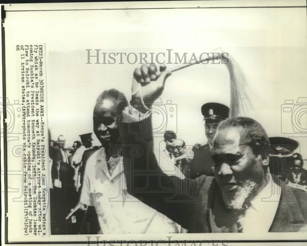 1966 Press Photo Kenya President Kenyatta swings whisk greeting Zambia's Kaunda.