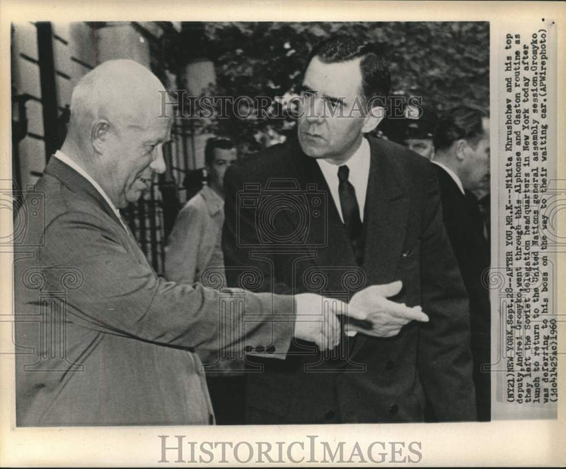 Load image into Gallery viewer, 1960 Press Photo Nikita Khrushchev and Gromyko leave delegation to waiting car

