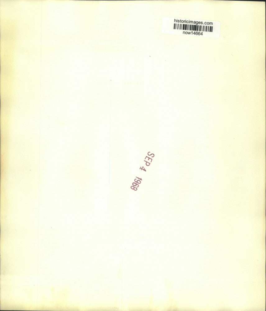 1968 Press Photo Elderly Iranian man shovels rubble from earthquake destruction