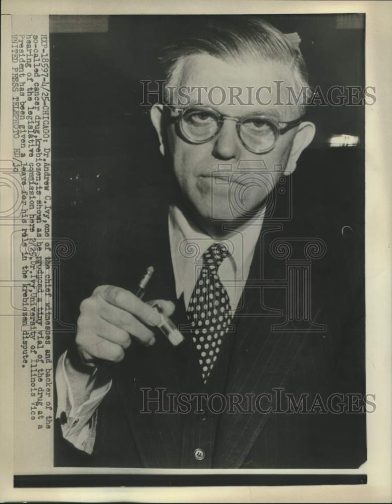 1953 Press Photo Dr. Andrew Ivy holds vial of cancer drug krebiozen at hearing.