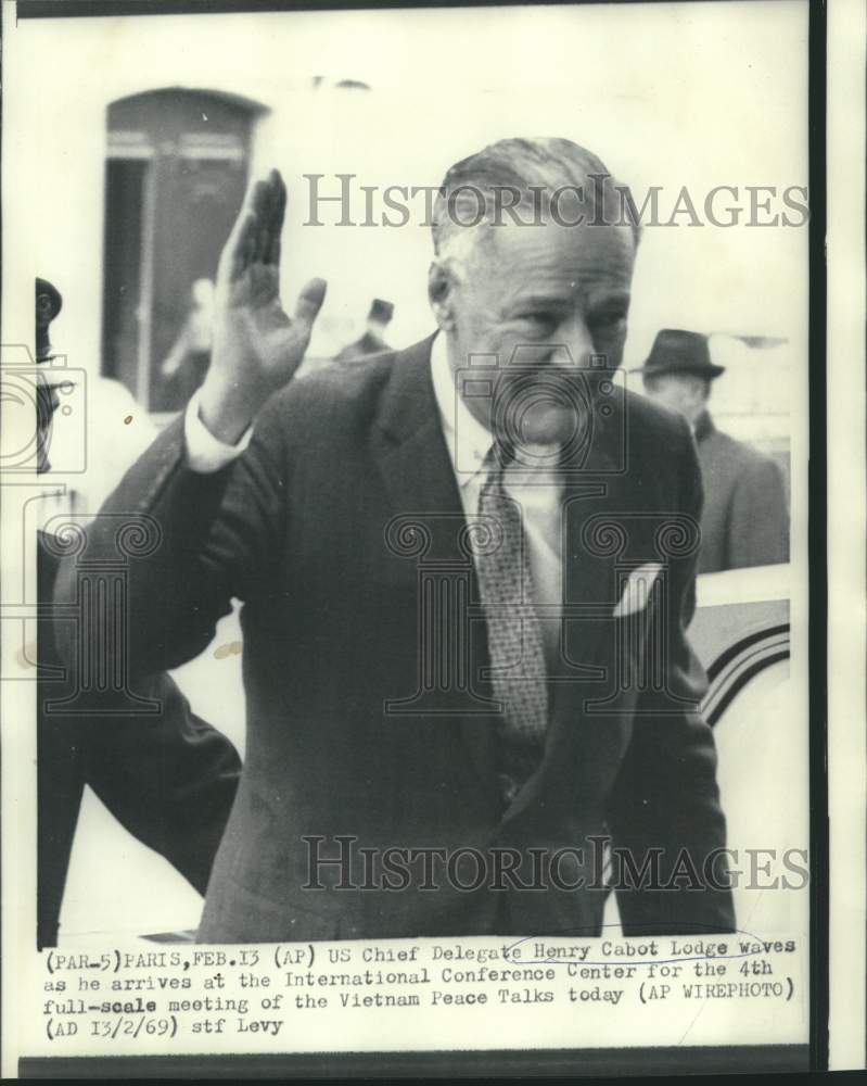 Load image into Gallery viewer, 1969 Press Photo Henry Cabot Lodge waves on Vietnam Peace Talks arrival.
