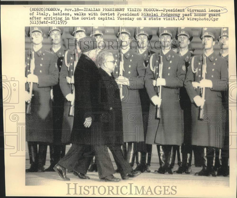 Load image into Gallery viewer, 1975 Press Photo Italy's Leone and Soviet Podgorny walk past honor guard
