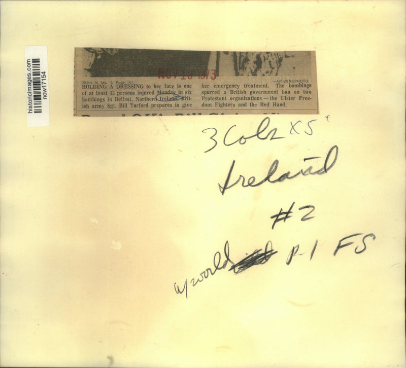 Load image into Gallery viewer, 1973 Press Photo Sgt. Turford gives treatment to bombing victim in Belfast
