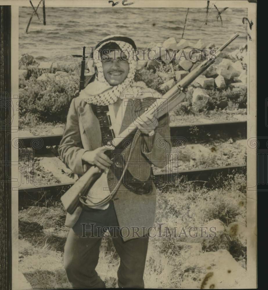 1958 Press Photo Lebanese youth guards railroad line at Sidon, Lebanon