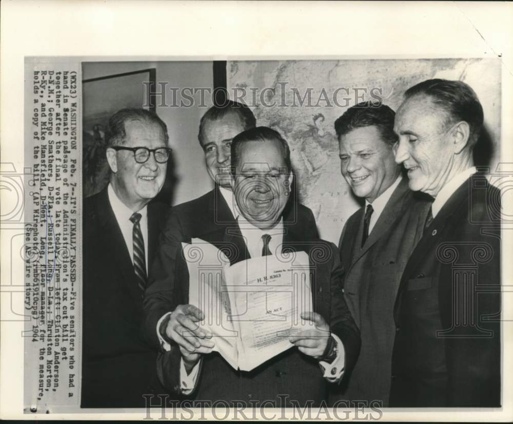 1964 Press Photo Senator Russell Long holds copy of tax cut bill with others