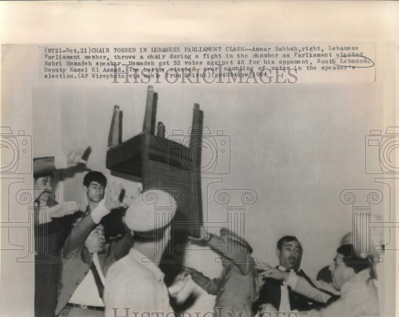 Load image into Gallery viewer, 1964 Press Photo Anwar Sabbah throws chair in fight in Parliament, Lebanon
