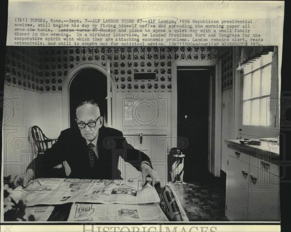 1974 Press Photo Alf Landon. turning interview, with morning coffee and paper
