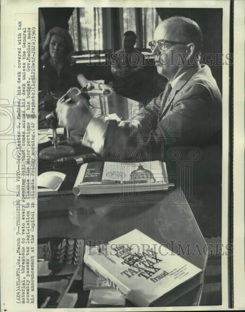 Load image into Gallery viewer, 1969 Press Photo Georgia Governor Lester Maddox at desk covered with tax materia
