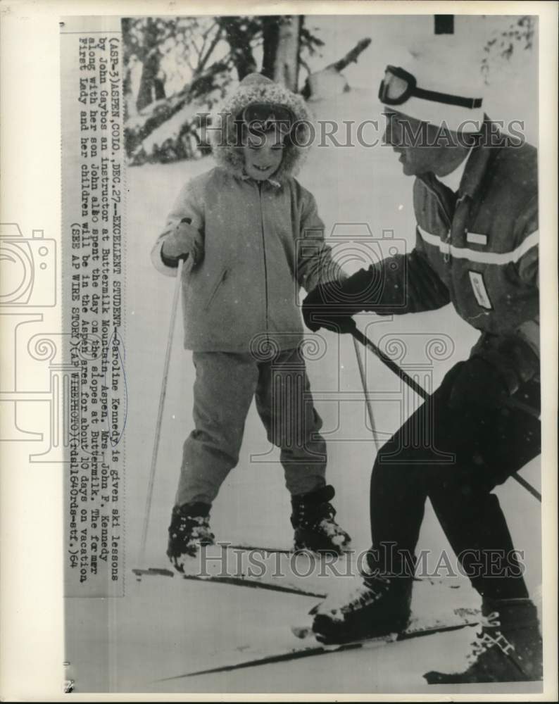 Load image into Gallery viewer, 1964 Press Photo Caroline Kennedy given ski lessons by instructor John Gaybos
