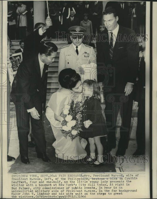 1966 Press Photo Mrs.Marcos bestows kiss to Cynthia Seuffert as others watch