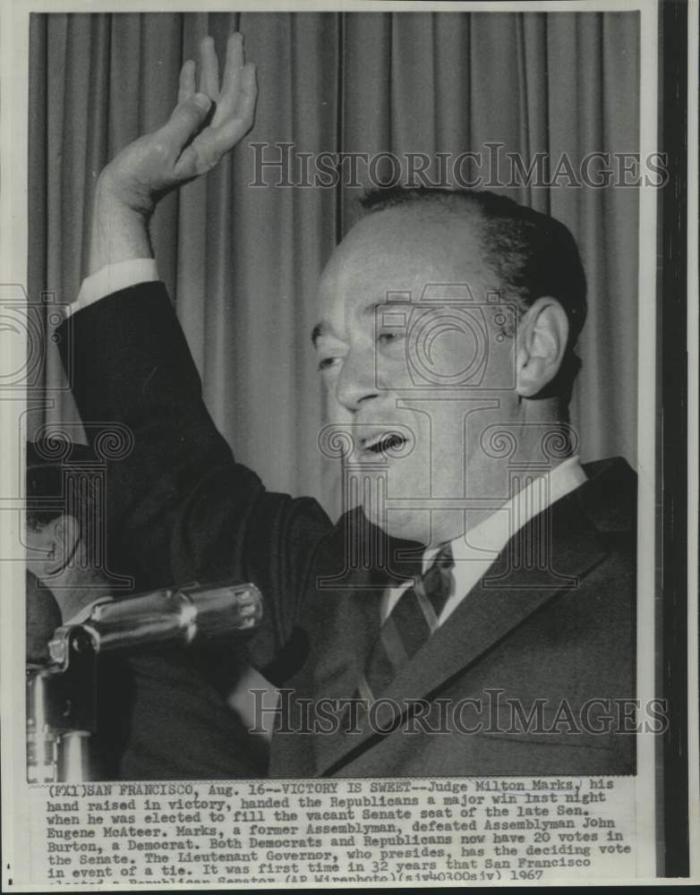1967 Press Photo Judge Milton Marks with hand raised in victory. - now20458