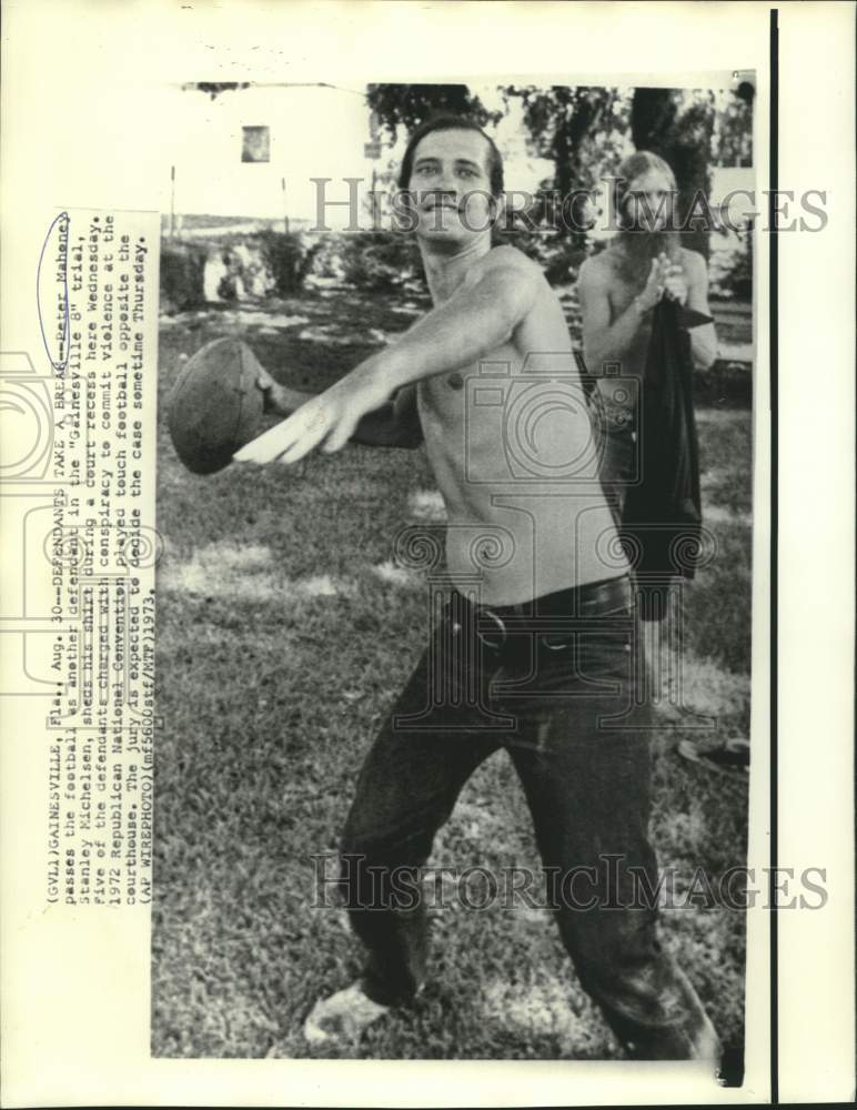 Load image into Gallery viewer, 1973 Press Photo Peter Mahoney and another Gainesville 8 defendant play football
