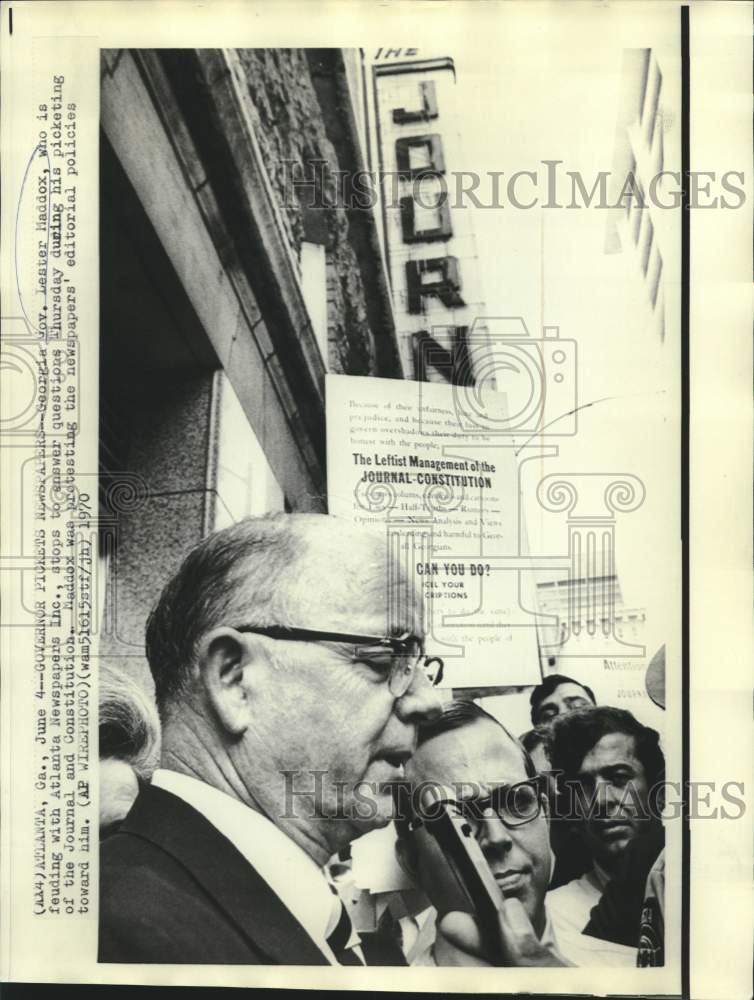 Load image into Gallery viewer, 1970 Press Photo Governor Maddox answers questions during newspaper picketing.
