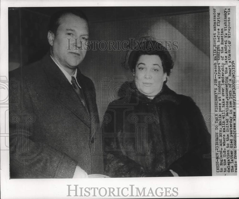 Load image into Gallery viewer, 1954 Press Photo Jacob Malik and wife pose at London airport enroute to U.S.

