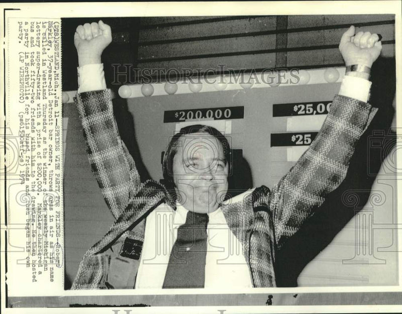 Load image into Gallery viewer, 1974 Press Photo Michigan lottery winner Robert Markley throws arms in air.
