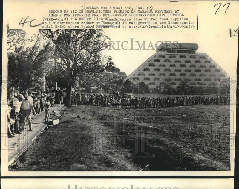 Load image into Gallery viewer, 1973 Press Photo Refugees line up to get food near hotel, Managua, Nicaragus

