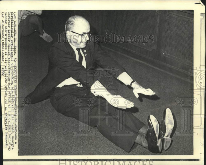 Load image into Gallery viewer, 1970 Press Photo Georgia Governor Lester Maddox does sit-ups in Capitol office.
