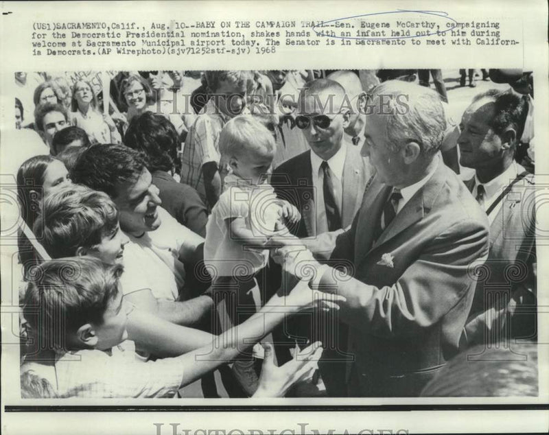Load image into Gallery viewer, 1968 Press Photo Senator Eugene McCarthy shakes babies hand at Sacrament airport
