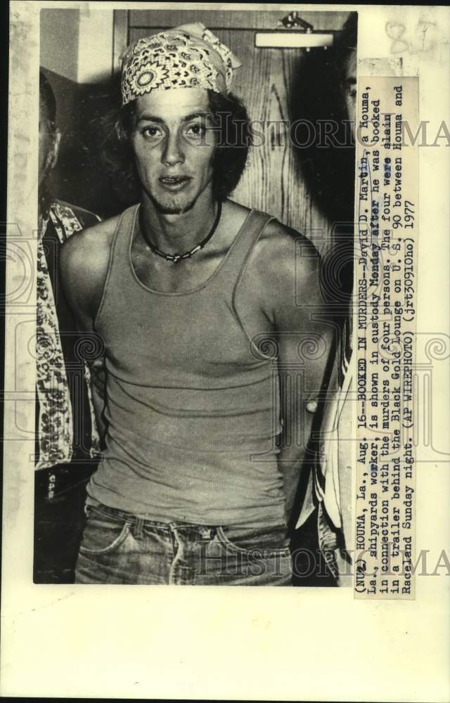 1977 Press Photo David Martin booked in connection with murders of four persons