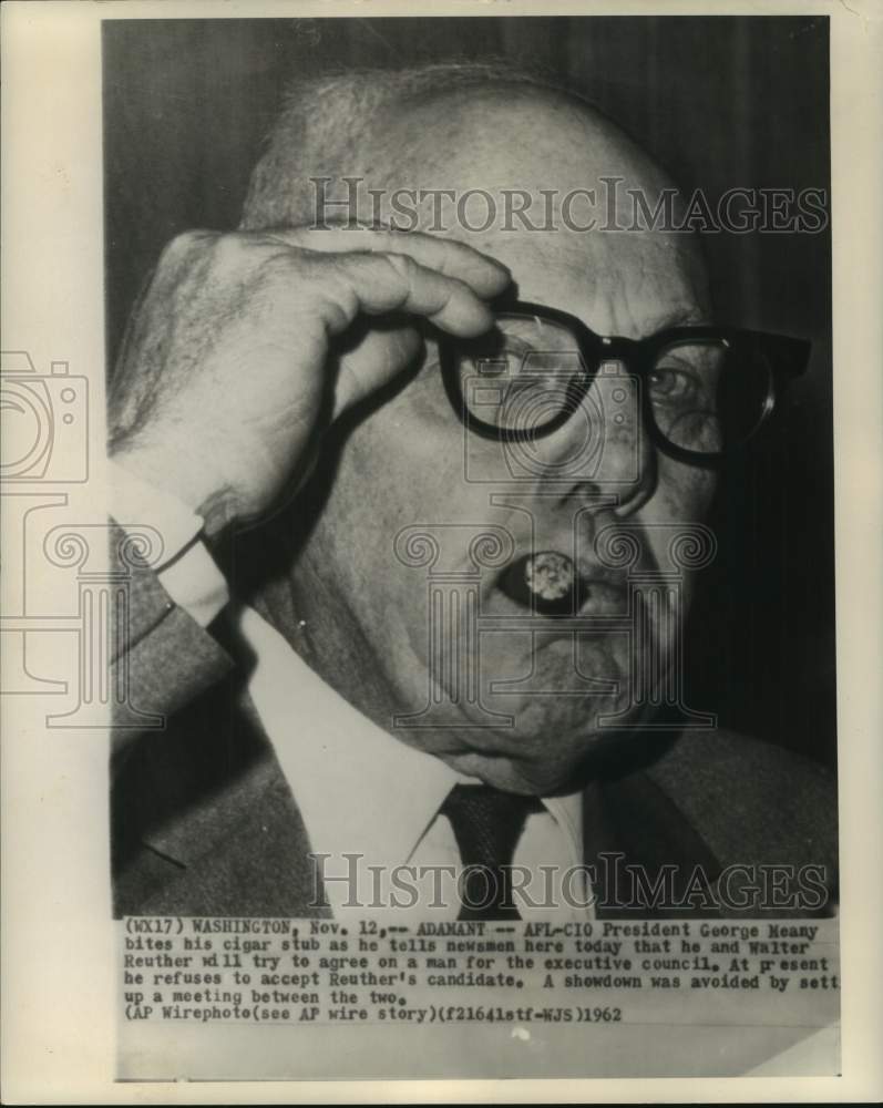 1962 Press Photo AFL-CIO President Meany bites cigar stub in Washington
