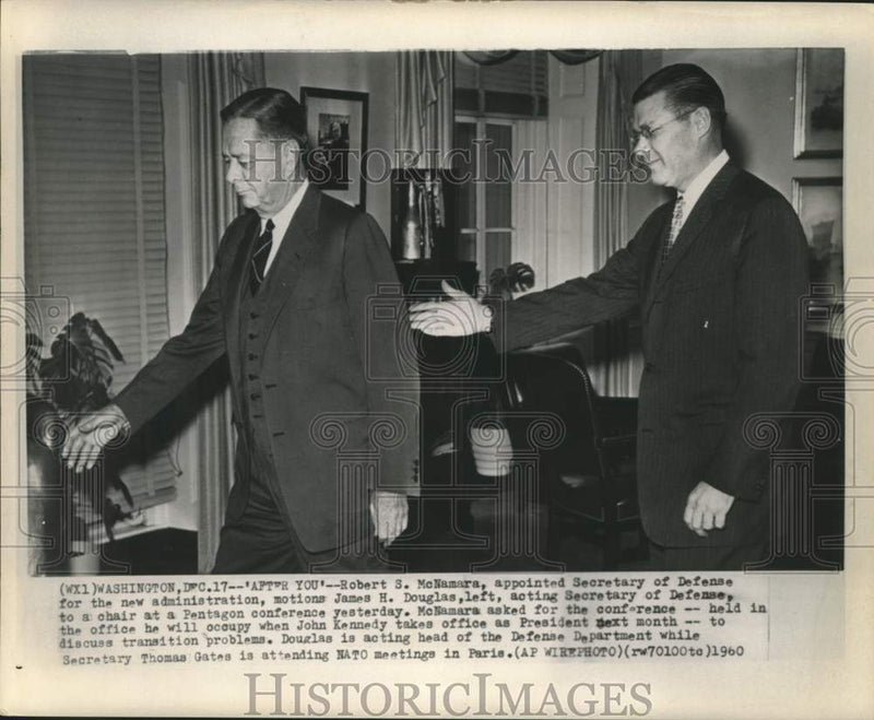 Load image into Gallery viewer, 1960 Press Photo Robert McNamara motions James H. Douglas to chair at Pentagon
