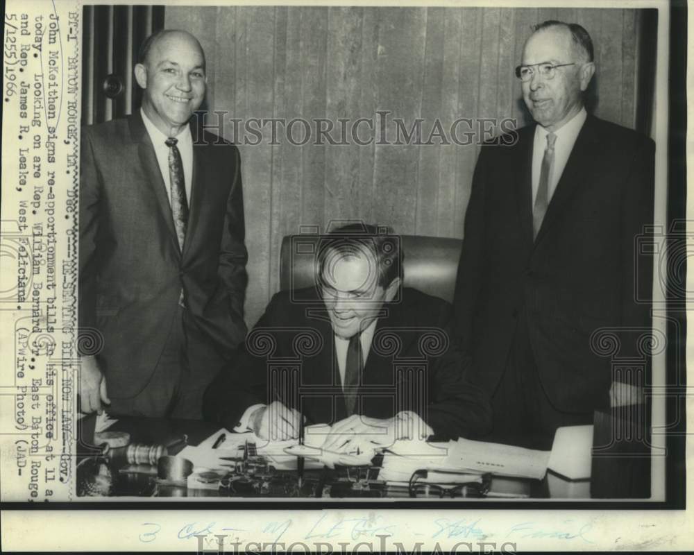 1966 Press Photo Governor McKeithen signs bills as Representatives look on