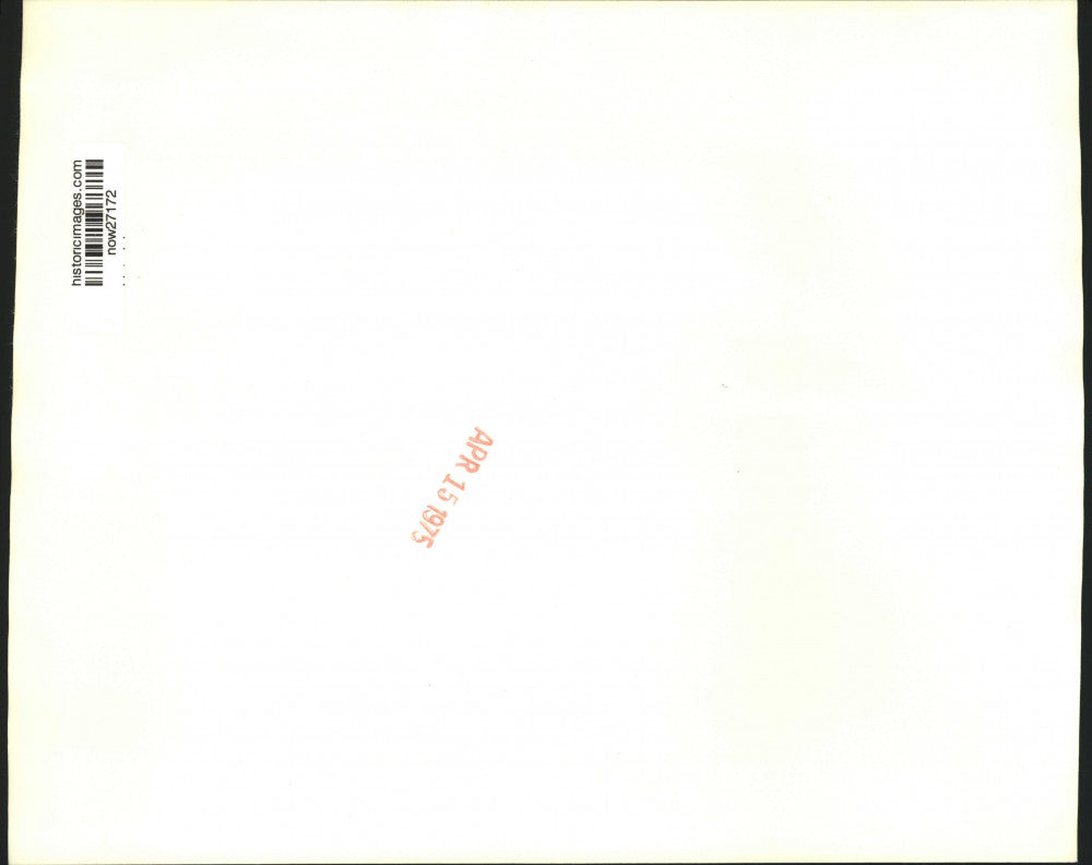 1975 Press Photo Ryokichi Minobe touches blank eye of unfinished Dharma doll.