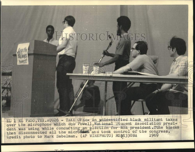 Load image into Gallery viewer, 1969 Press Photo Black militant takes microphone from Bob Powell of NSA congress

