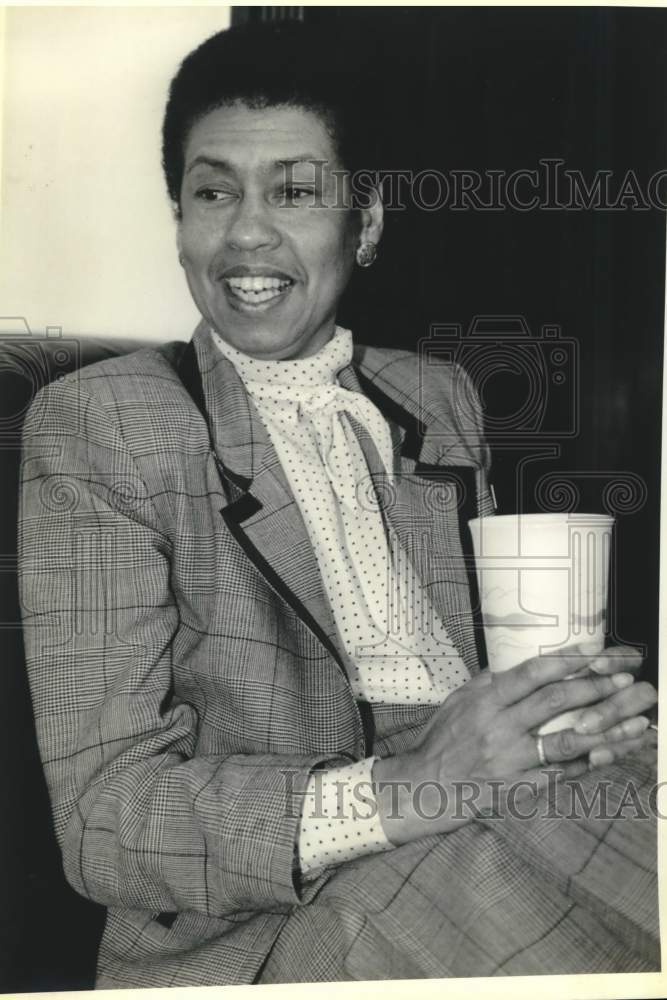 Load image into Gallery viewer, 1991 Press Photo Eleanor Holmes Norton sits with cup - now30656
