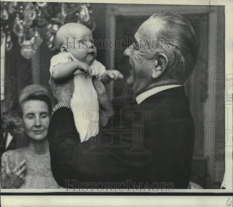Load image into Gallery viewer, 1967 Press Photo President Johnson holds first grandchild at the White House
