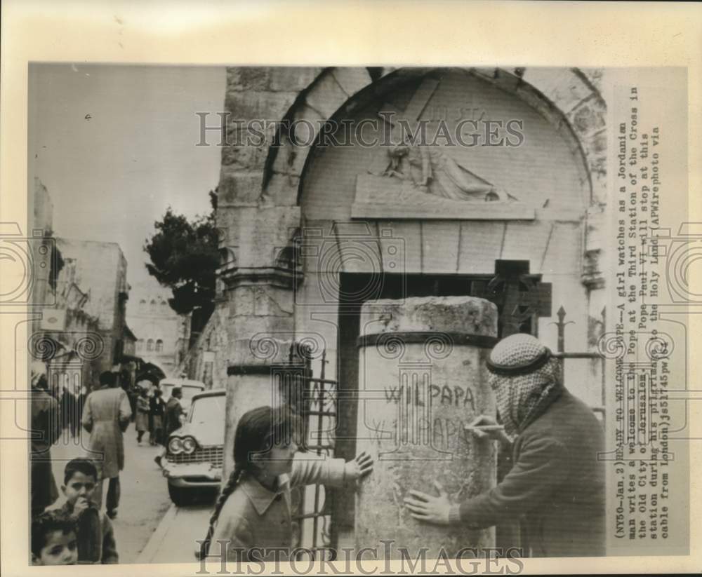 1964 Press Photo Girl watches Jordanian write welcome message for Pope Paul VI