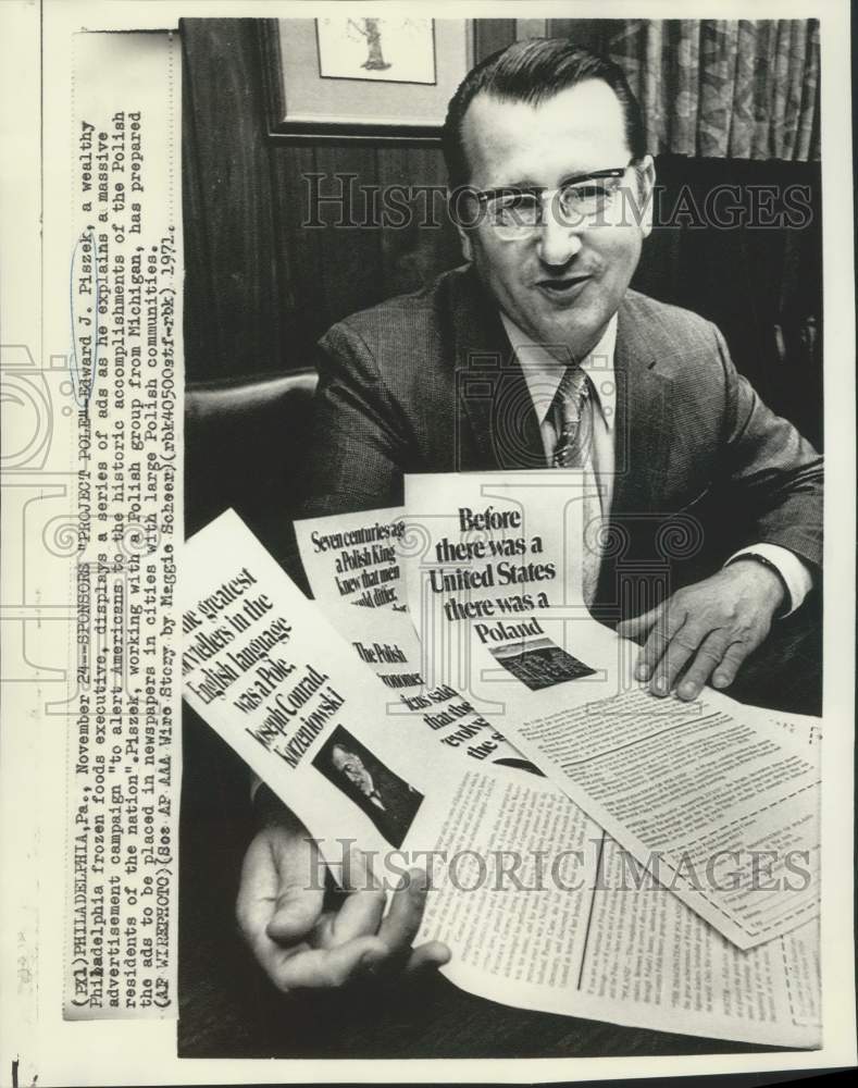 1971 Press Photo Executive Edward J. Piszek displays ad series for newspapers