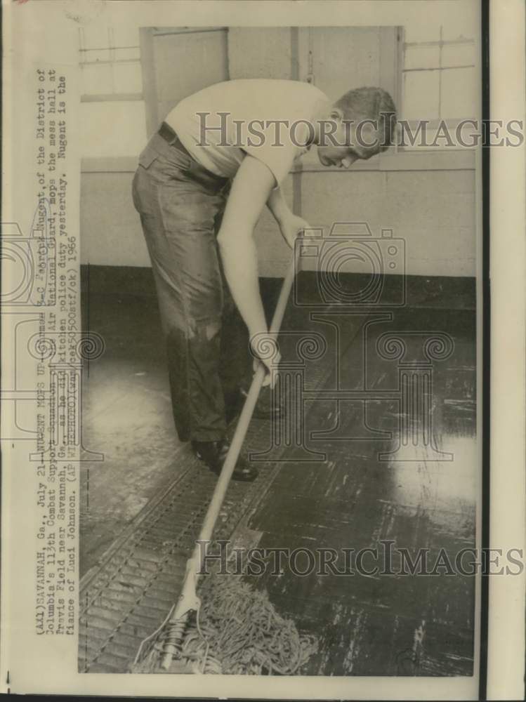 Load image into Gallery viewer, 1966 Press Photo Airman 3-Class Nugent mops mess hall at Travis Field
