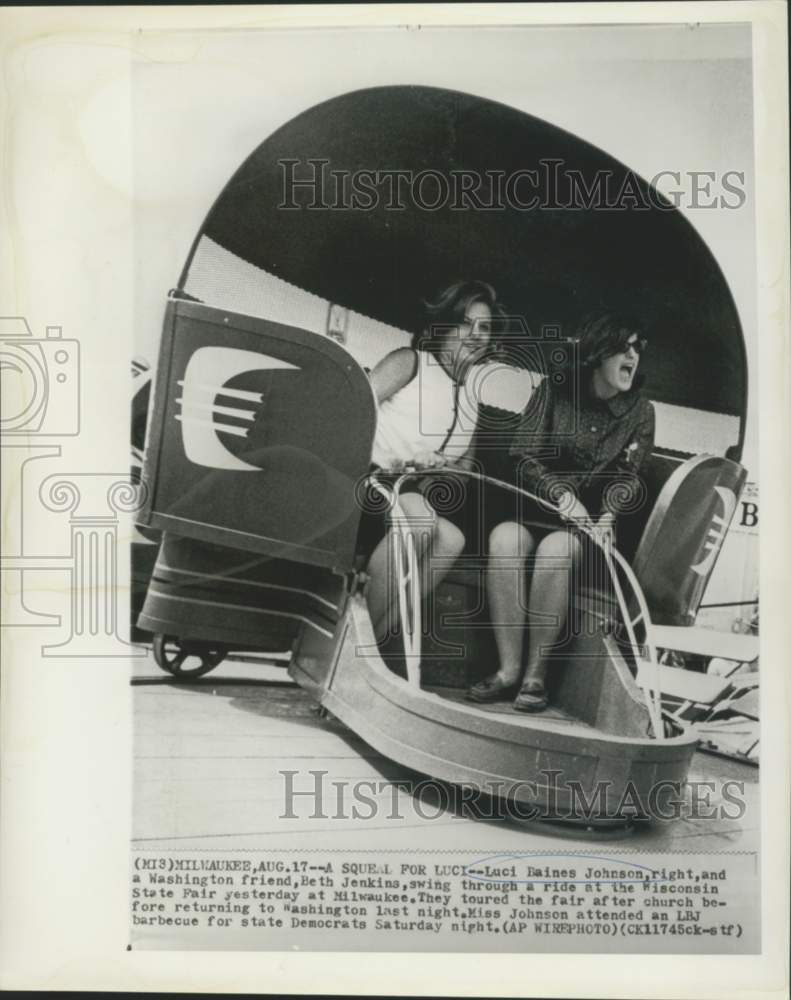 Load image into Gallery viewer, 1964 Press Photo Luci Johnson and Beth Jenkins enjoy Wisconsin State Fair ride
