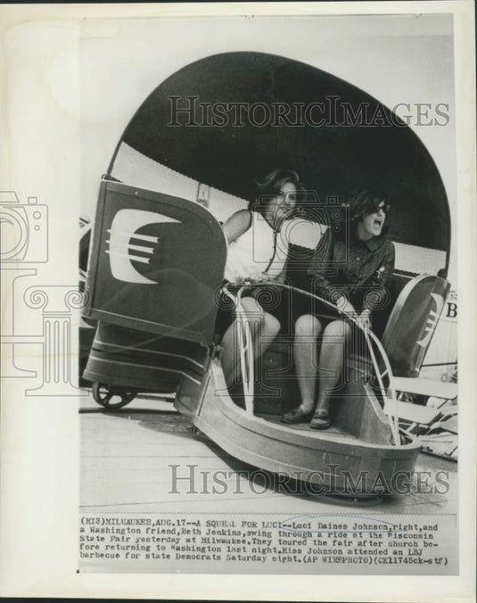 1964 Press Photo Luci Johnson and Beth Jenkins enjoy Wisconsin State Fair ride