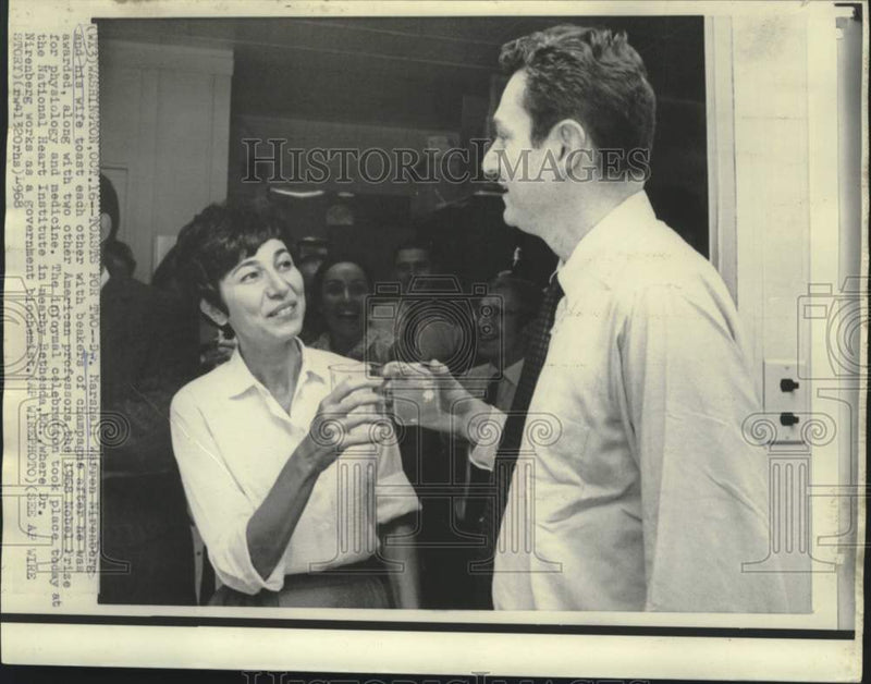 Load image into Gallery viewer, 1968 Press Photo Champagne toast for Nobel winner Dr. Nirenberg and wife in MD
