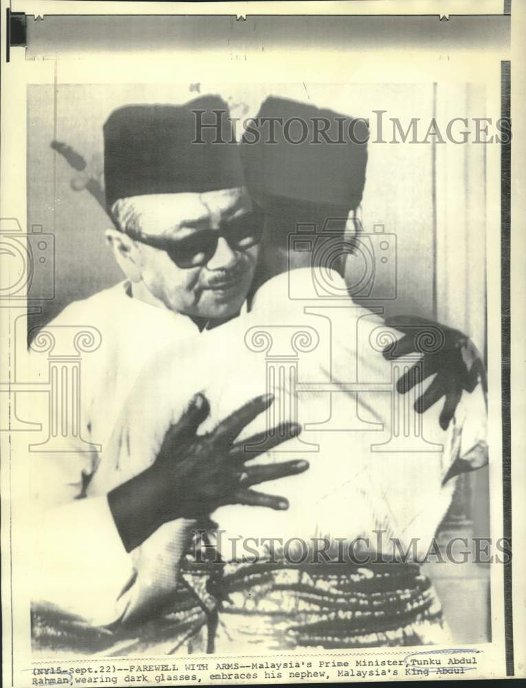 Load image into Gallery viewer, 1970 Press Photo Malaysia's Prime Minister Tunku Abdul Rahman embraces nephew
