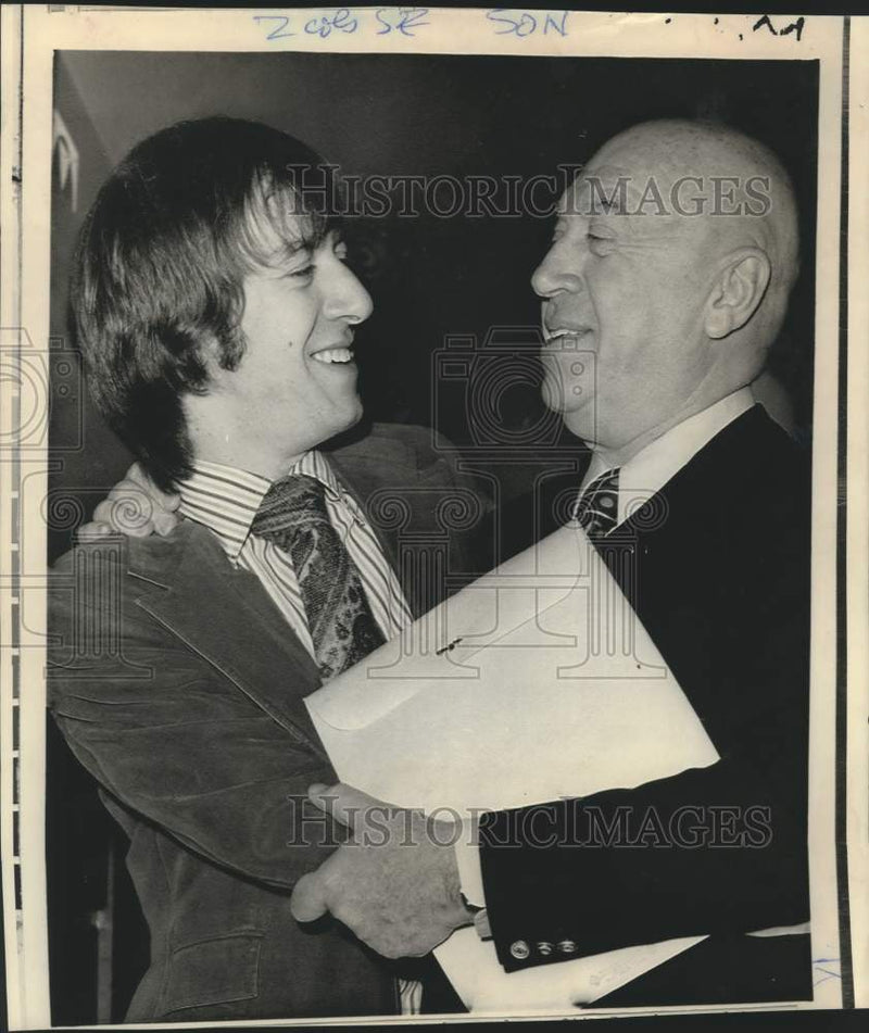 Load image into Gallery viewer, 1971 Press Photo Producer Otto Preminger embraces adopted son, Erik - now33407
