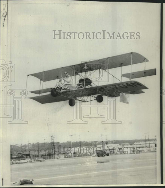 1966 Press Photo Pete Bowers in women's clothes on 1912 replica bi-plane